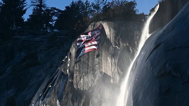 ‘Distress flag’ flies over Yosemite to protest cuts as crowds view firefall