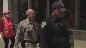 CHP, BART and Oakland police walk through Chinatown to meet merchants