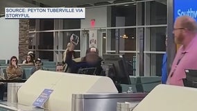 Video: Woman tries to kick Southwest employee, punches computers in viral tirade