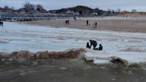 Drone captures kids playing on frozen Lake Michigan waves: ‘almost certain death’