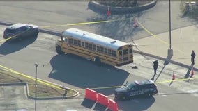 Girl in critical condition, boy hospitalized after being hit by school bus at suburban high school