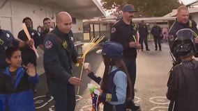 San Jose firefighters pass out Glo Sticks on Halloween