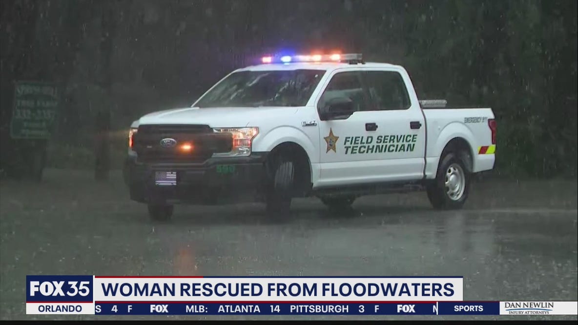 Woman rescued from floodwaters