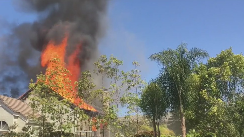 Standoff at fiery Laguna Hills home ends peacefully