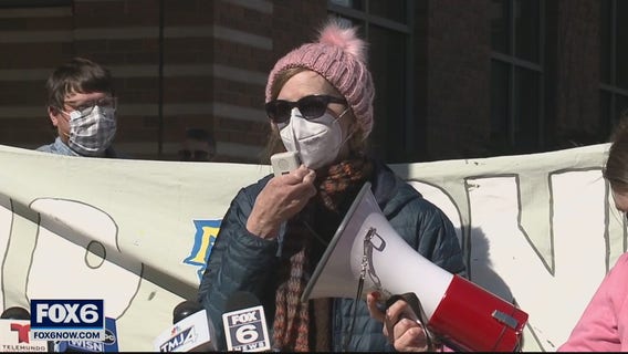 Group protests Marquette layoffs, calls for worker reinstatement