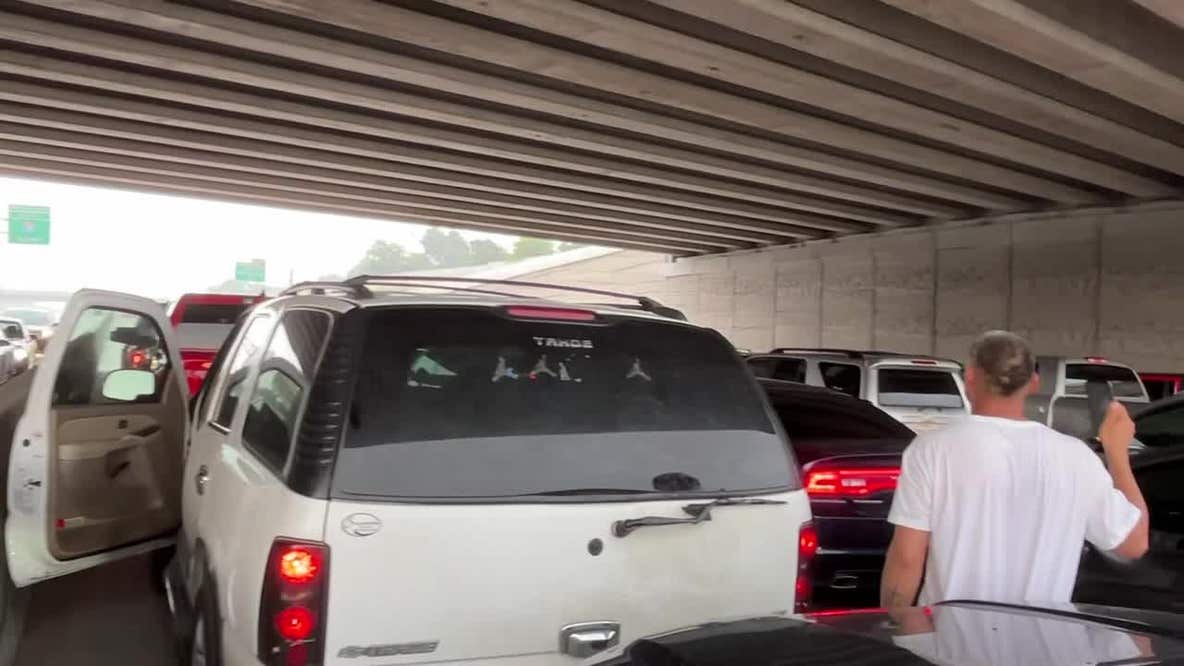 Cars block traffic while trying to avoid hail