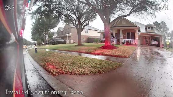 VIDEO: Cy-Fair firefighters take shelter in resident's garage during high winds