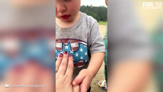 Adorable video captures toddler's excitement over mom's Spider-Man nails