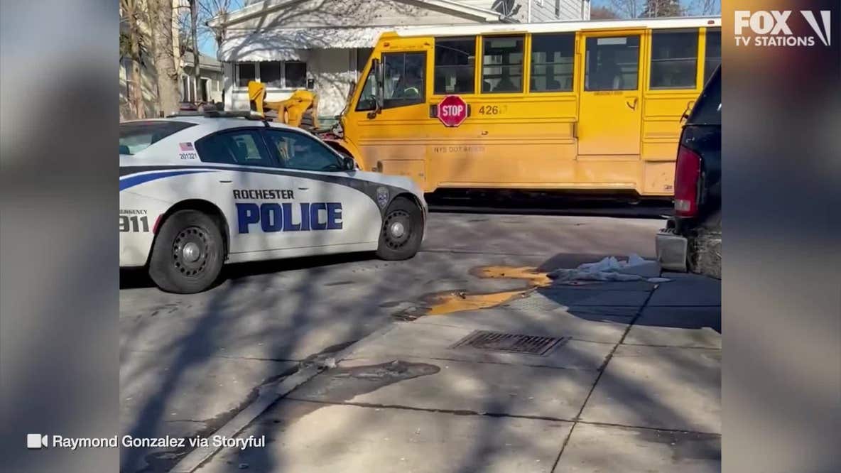 Watch: Carjacking suspects collide with school bus during chase, take off on foot
