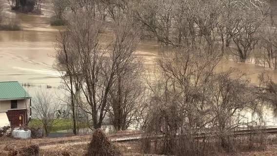 Driver swept into floodwaters rescued by 3 linemen restoring power in Virginia