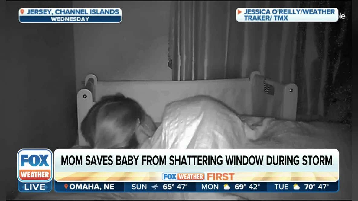 Mom scoops baby up during terrifying storm
