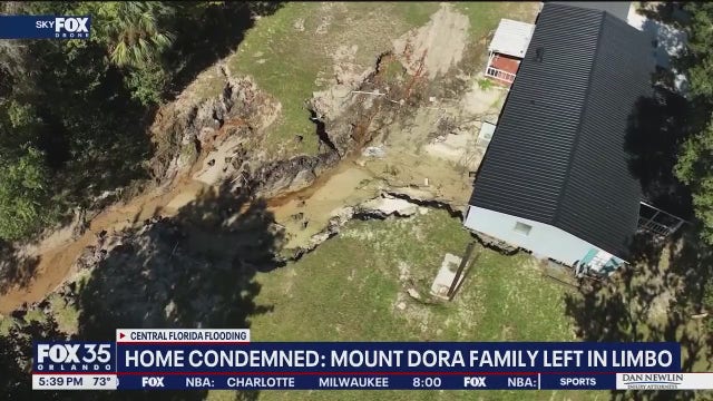 Torrential rain carves massive gully under Mount Dora house, displacing family