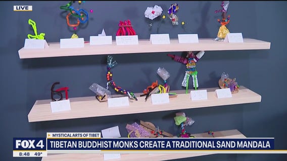 Buddhist monks create traditional sand mandala