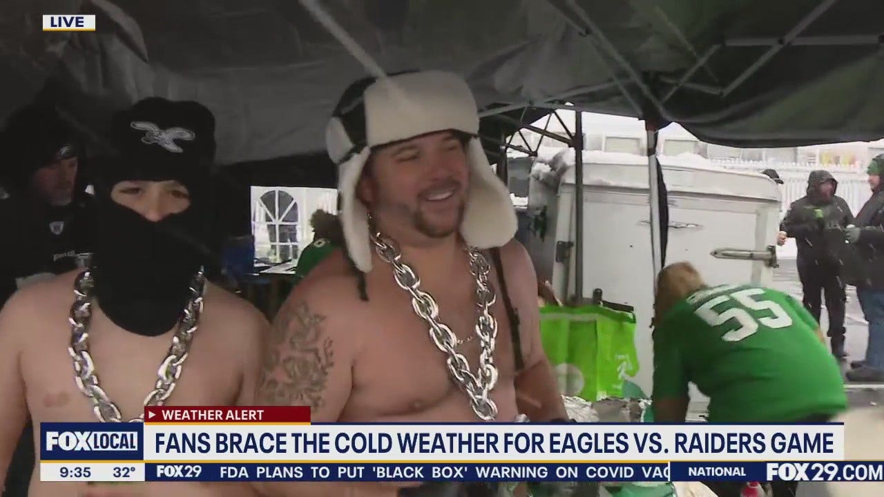 Eagles fans tailgate in bitter temps, several inches of snow