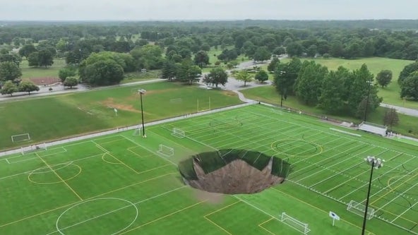 Video captures moment sinkhole opens on soccer field