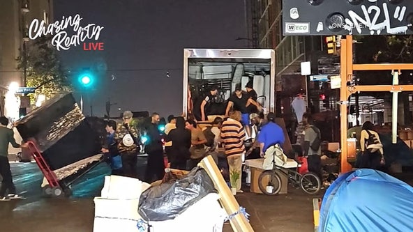 Moving truck dumps furniture at LA's Skid Row