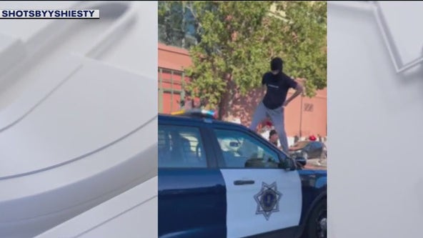 Masked sideshow spectators jump, smash windshield of San Jose police car