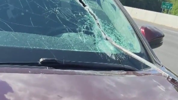Crowbar smashes through windshield on interstate