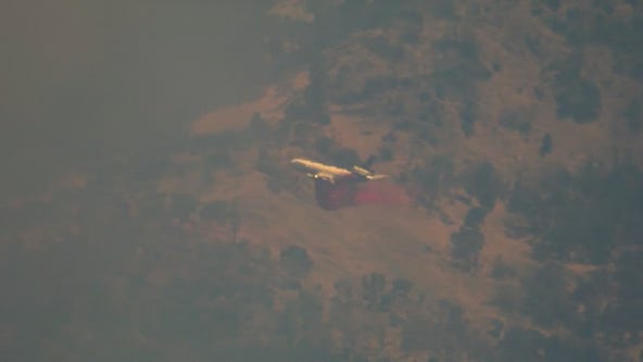 Cal Fire helicopter douses Calistoga vegetation fire