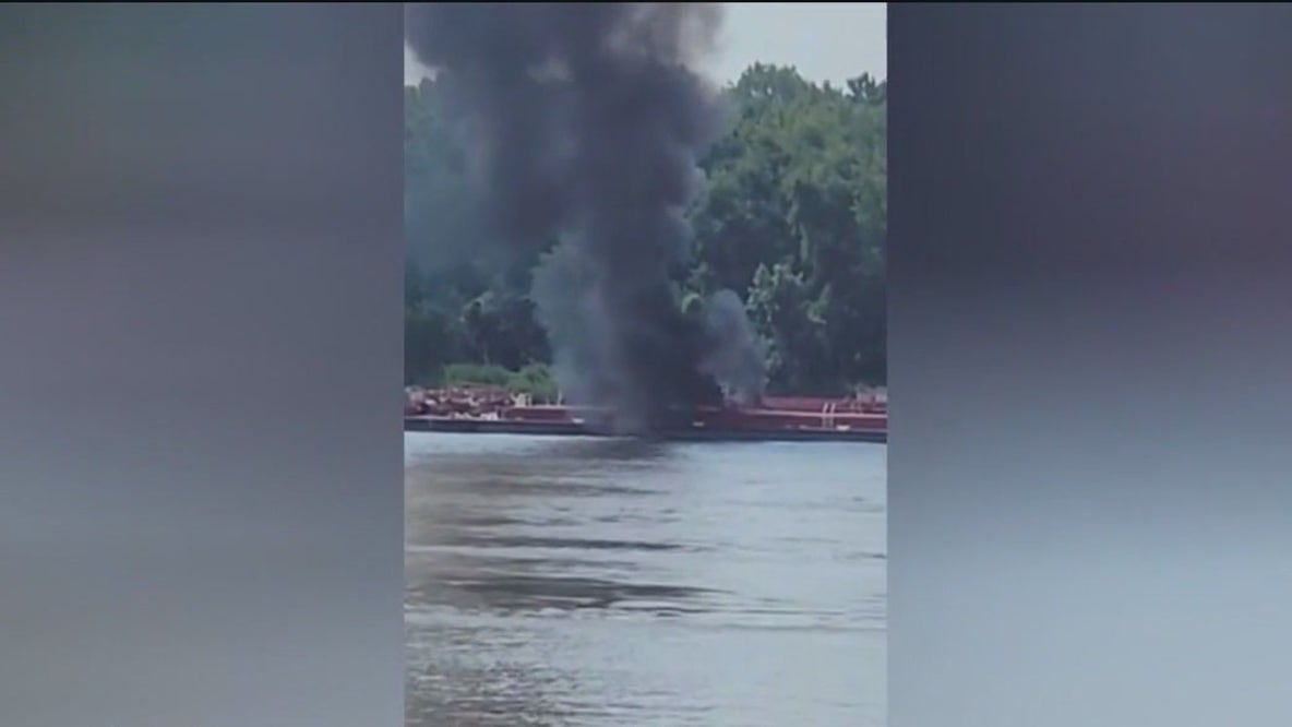 Helicopter crashes into barge on Mississippi River