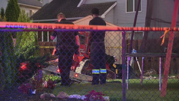 Elderly driver crashes through Canton garage, hits man in backyard