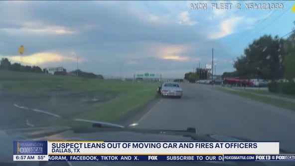 WATCH: Suspect leans out of moving car, fires at TX officers