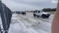 North Texas Jeep Club helps 18-wheeler across icy roads in Tarrant County