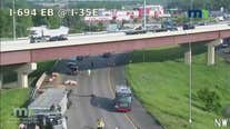 Traffic cam: Pigs on freeway after semi tips on I-694