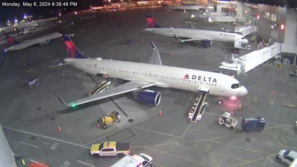 VIDEO: Delta plane catches fire at Sea-Tac, passengers evacuate using slides