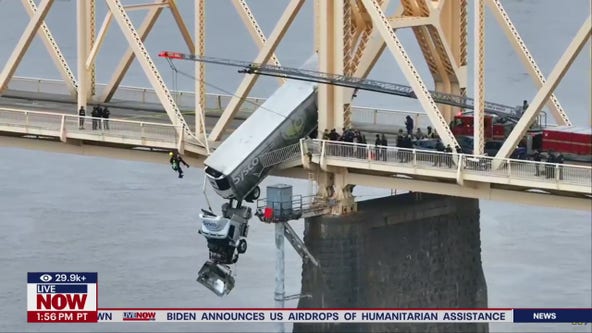 Woman rescued from semi truck dangling over Ohio River