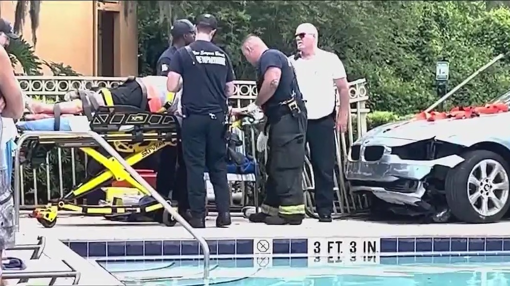 Video shows car crashing onto apartment pool deck