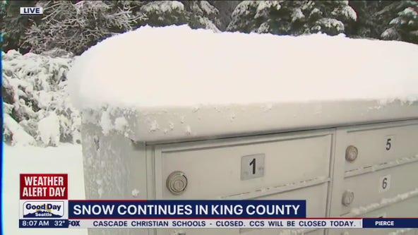 Snow continues to fall in King County