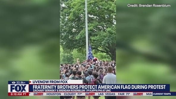 Fraternity brothers protect US flag from protesters