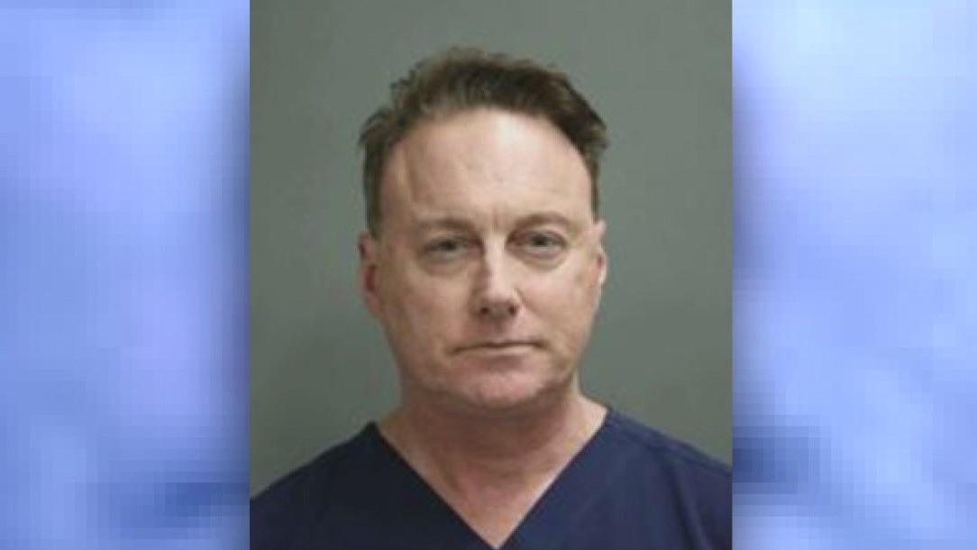 Doctor charged with assaulting 9 men