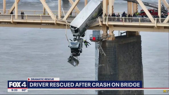 Big rig driver rescued after crash on bridge