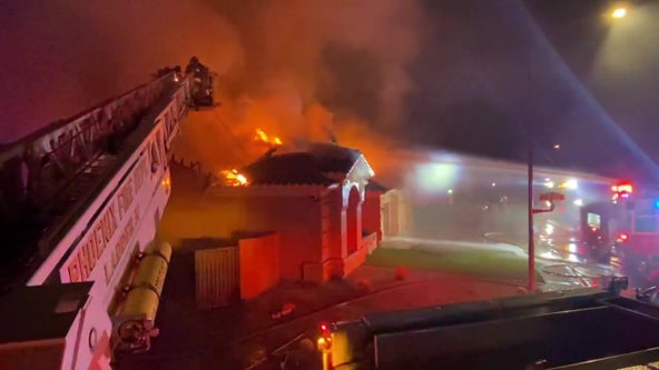 Crews battle Phoenix house fire