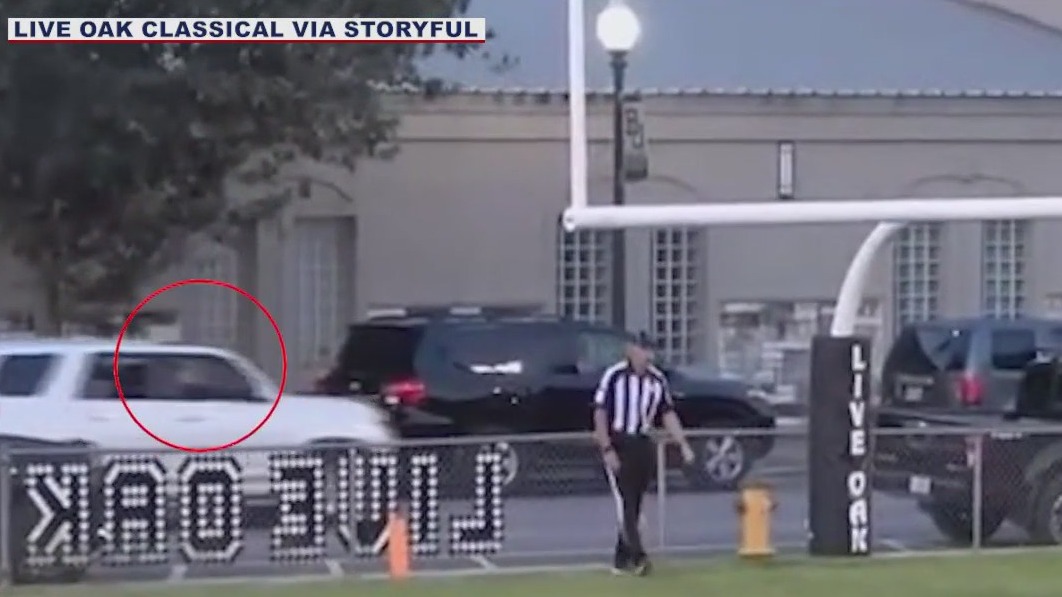 Teen kicks football through goal posts and into car