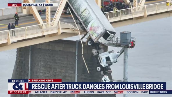 Person rescued after semi-truck dangles from Louisville bridge