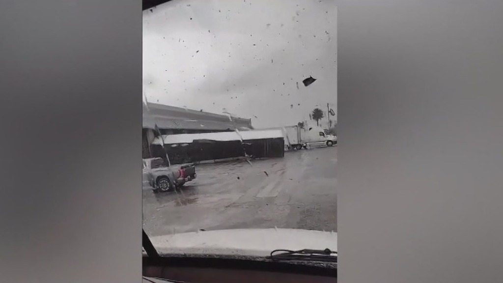 Tornado confirmed in Montebello, destroying roofs, causing debris to fly