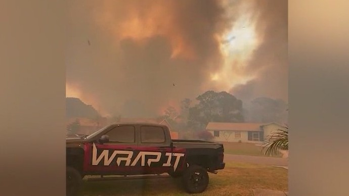 Multiple homes evacuated due to large Palm Bay brush fire