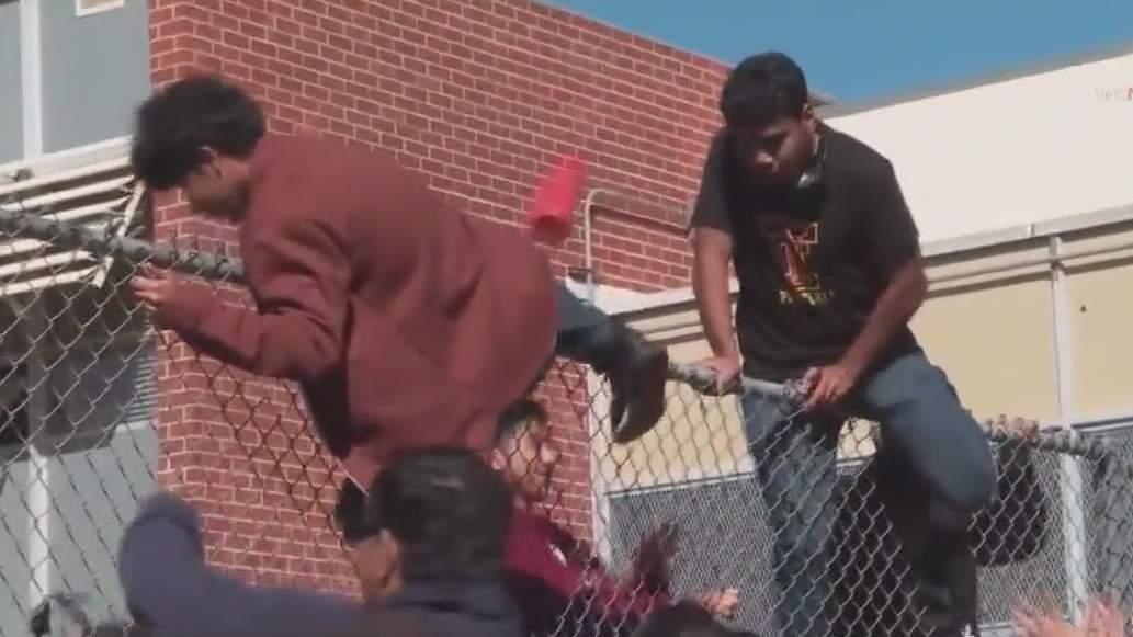 Kids scale fence amid alleged school threat
