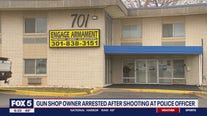 Gun shop owner arrested after shooting at police officer