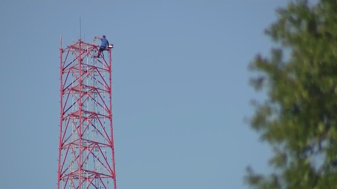 Man arrested for climbing communications tower