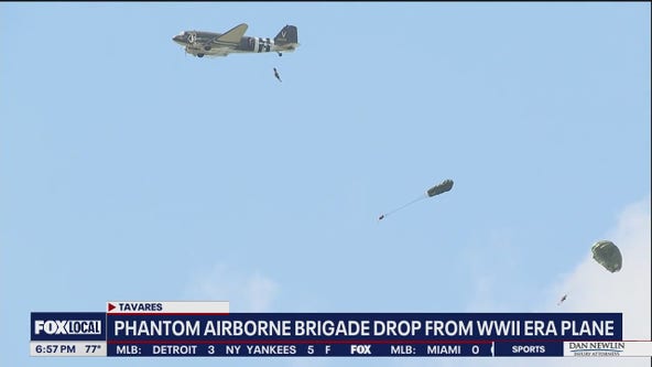 Veteran paratroopers jump from WWII-era plane