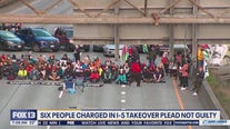 6 people charged in I-5 takeover plead not guilty