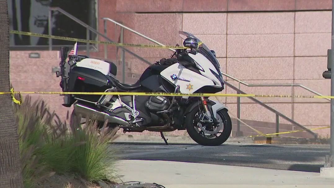 Motorcycle cop shot in back in West Covina