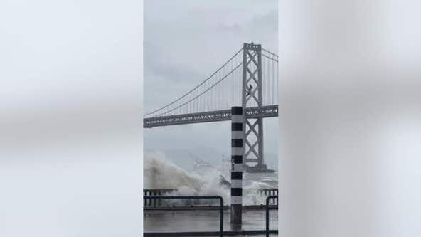 Bicyclist in San Francisco blasted by waves