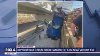 Truck hangs off I-35E in Dallas after crash