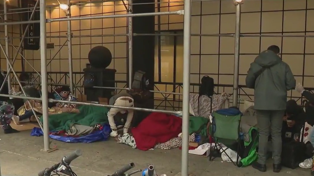 NYC migrants camp out at Hell's Kitchen hotel