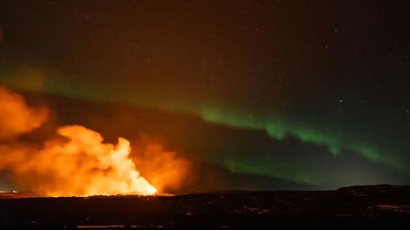 Iceland volcano erupts against backdrop of Northern Lights